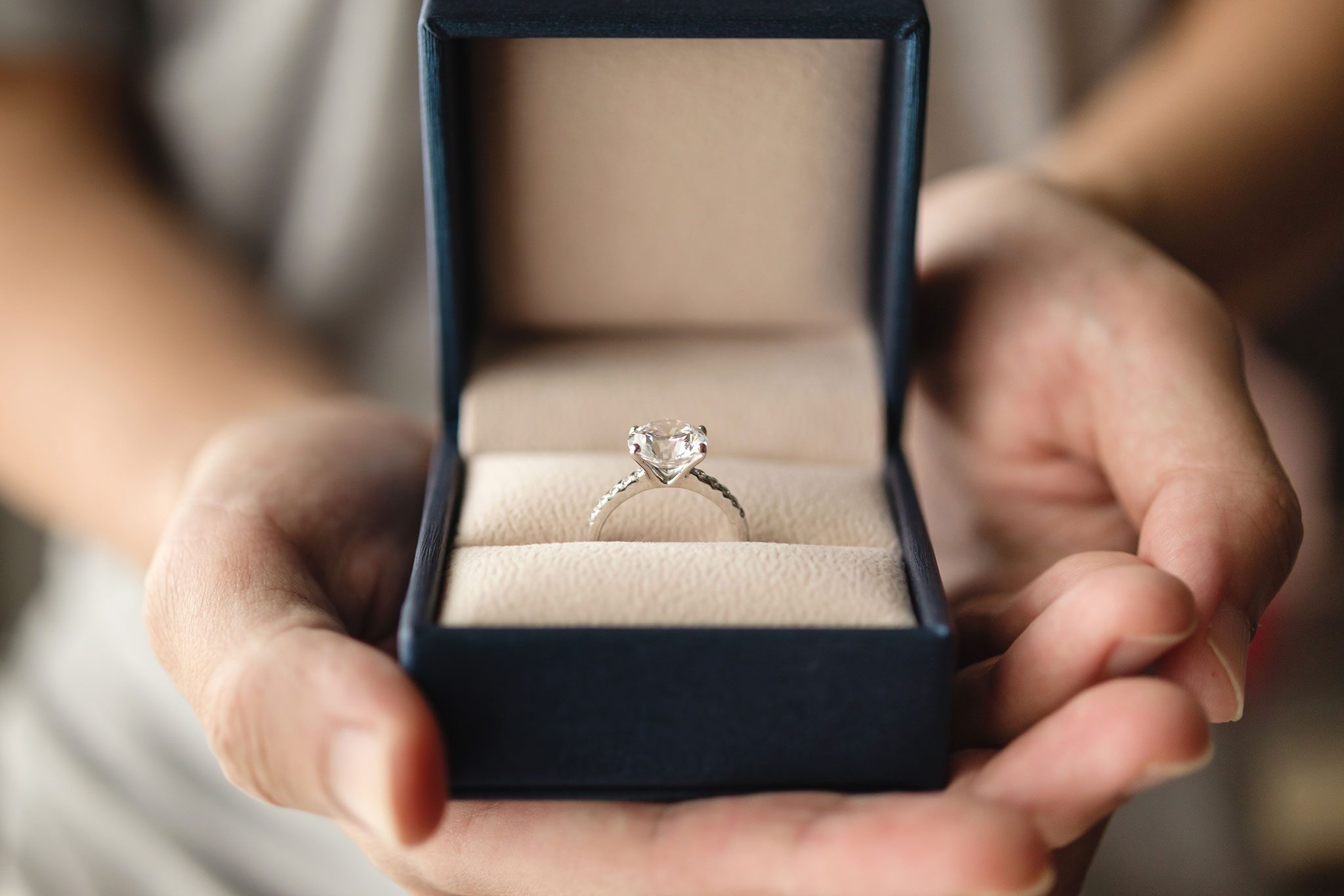 Diamond ring in a blue velvet box.