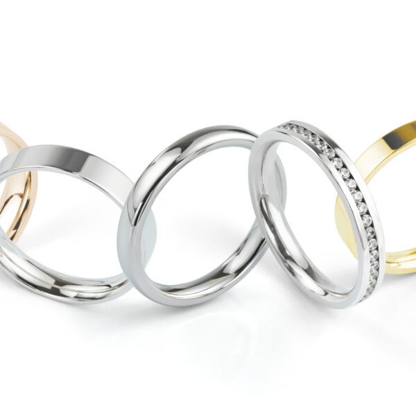Various gold and silver rings in a row.