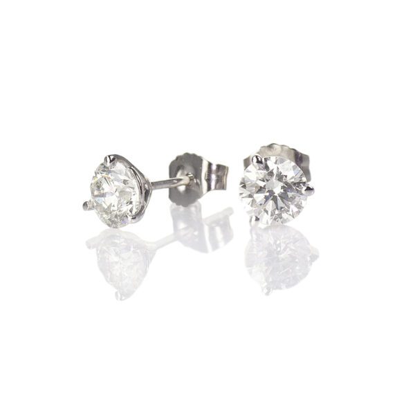 Diamond stud earrings on white background.
